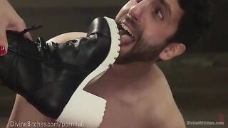 The muscled dominatrix beats and dominates her slaveboy in a fierce wrestle