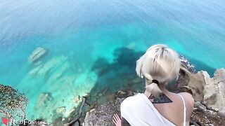 A cute girl passionately sucks the penis of her ex-boyfriend on the ocean shore