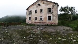 An exhibitionist girl is walking in a ruin with her sexy bae