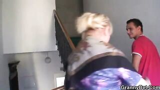 A hot granny with freckles and big tits gets fucked by a young stud