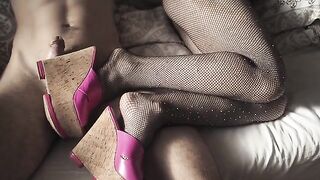 A seductive girl in stockings and high heels