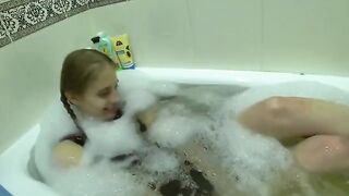 A cute girl fucks with her friend's wife in the kitchen