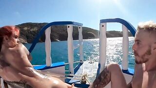 A man and a woman have sex on a boat in the sea, oiled up