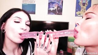 Lesbian beauties play with their sweet pussies using a dildo