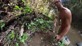 Couple engaged in passionate sex right in the jungle river