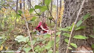 A sexy girl in a red riding hood costume is fucking with a big bad wolf outdoors