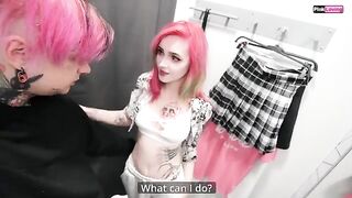 A chick is having fun with her boyfriend in the changing room of a shop