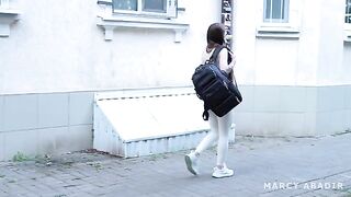 A girl is having fun with a stranger in a fake hostel setting