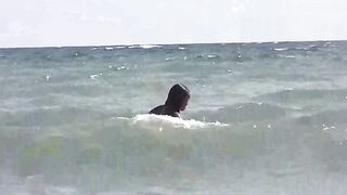 A group of girls are enjoying sunbathing naked on the beach