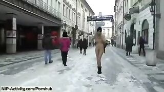 A hot student with big boobs is flashing her body on the street