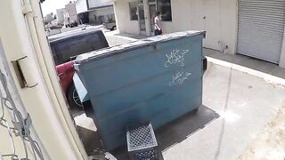 A girl was photographed having sex behind a garbage tank with a hidden camera