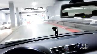 A girl is having fun with a guy while driving a car