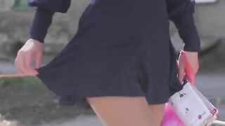 A very beautiful girl is removing her clothes and showing her body
