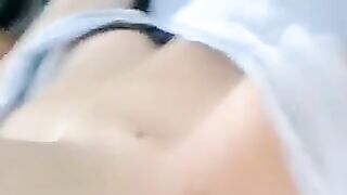 A half-naked girl tells lies and caresses her body with her hands