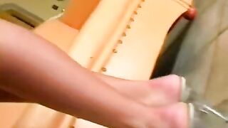 Beautiful woman masturbating on the leather chair