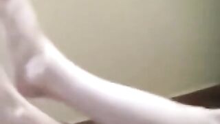 A naked girl with big tits is smoking in the room