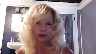 A mature woman caresses herself in the bathroom with a toy, feeling amazing