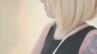 A blonde girl with tattoos masturbates and comes from orgasm