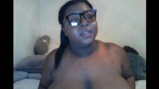 Black woman with big natural tits closed the camera during a live streaming session