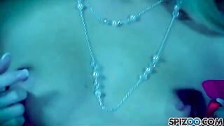 The blonde girl plays with a big dildo