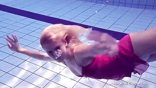 Helen has a naked swim in the pool and shows her body