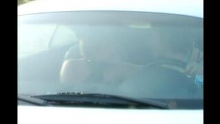 A blonde is having fun on the car hood with her shaved pussy