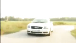 A blonde is having fun on the car hood with her shaved pussy