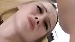 A sexy blonde is having fun with her friends on the table
