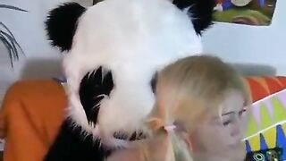 A young cute girl fucks with a bear Panda