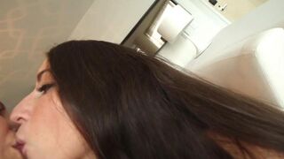 Two cute girls, Lena Nicole and Serena Blair, are fucking on the couch in a steamy scene