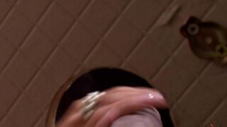 A beauty gave a blowjob through a hole in the toilet door