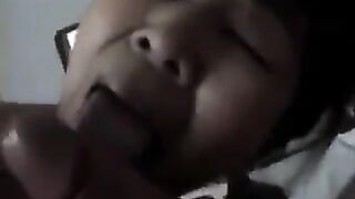 A Chinese woman practices her blowjob skills on him, showcasing her passion in a steamy homemade scene