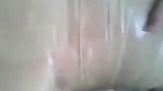 A guy put a condom on his dick and masturbated it with his hand
