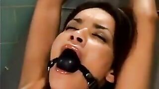 A bald man fucked a girl with a sex machine in hardcore style