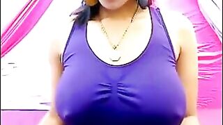 Her nipples are standing out, her t-shirt is wet