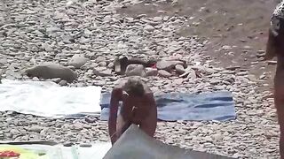 A little naked fun on the beach with a naughty couple
