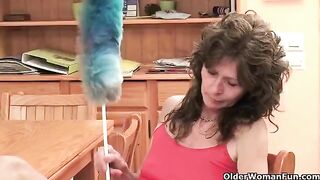 A mature woman plays with her pussy using a toy for masturbation