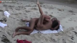 A couple is shooting without permission on the bare beach