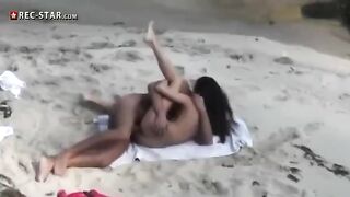 A couple is shooting without permission on the bare beach