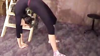 A cute gymnast has excellent flexibility and is very sexy to look at