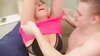 A hot woman is fucking with her grandson in a chair - Eporn