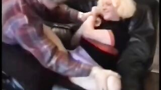 A pretty babe is having fun with a guy on his motorcycle