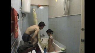 A hot sister has sex with her brother in the bathroom, hidden from view