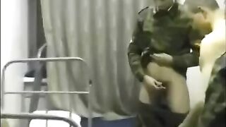 A hot chick is fucking with soldiers in the crowd in the barracks