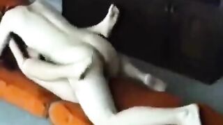 A married couple has sex at their home, showcasing passionate homemade moments