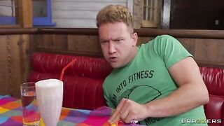 Two sexy girls are having fun in the kitchen of a greasy diner
