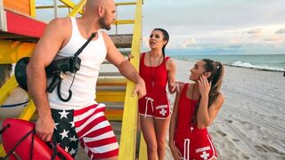 Two young lifeguards are having fun with a brunette in an FFM threesome