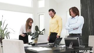 A woman with glasses has sex with two guys who finished on her stockings