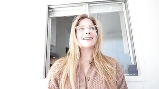 A blonde is sucking a dick under the table and getting a huge load on her face