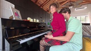 A hot woman makes love while her husband is playing the piano